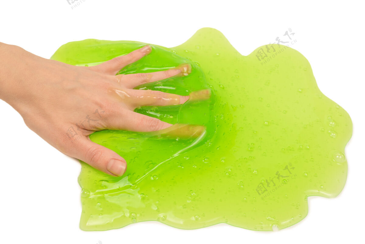科学绿色粘液玩具在女人手上隔离在白色背景上手野生弹性