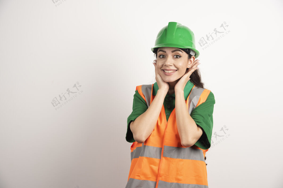 工人穿着制服和头盔的年轻女建筑师高质量的照片帽子企业专业