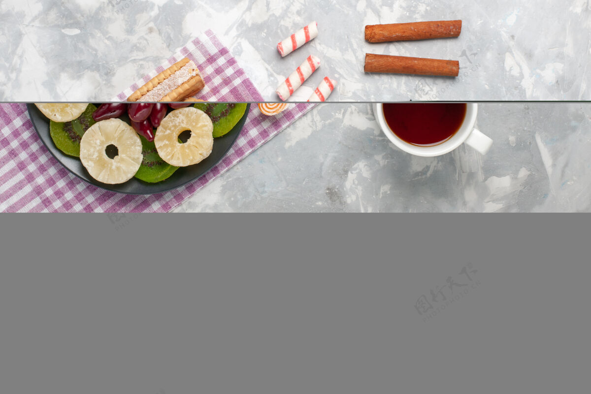 生的顶视图干果菠萝环山茱萸华夫饼茶和猕猴桃片白桌水果干糖酸顶部橡皮擦菠萝