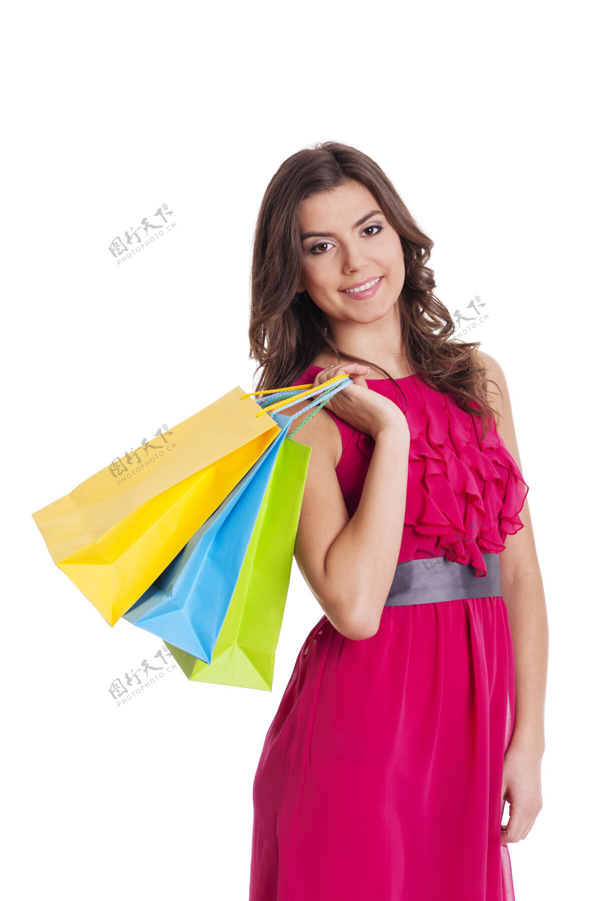 持有快乐的女人拿着她的购物袋太阳裙卷发顾客